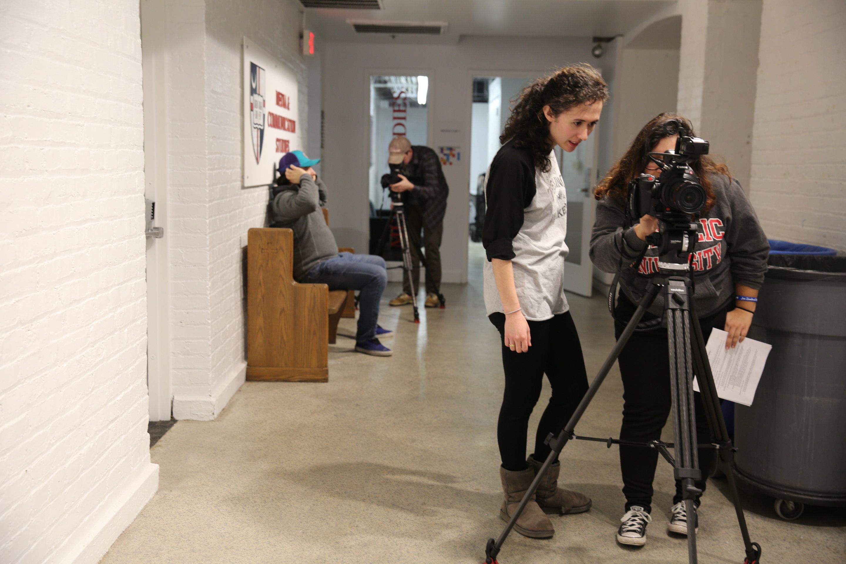 students filming assignments in lab